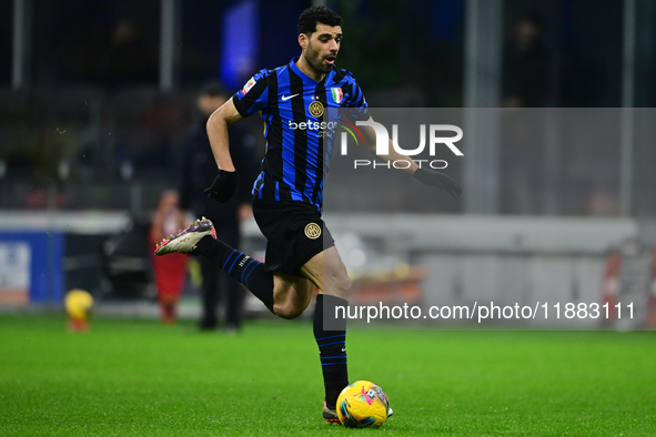 Mehdi Taremi of Inter Milan is in action during the Coppa Italia Frecciarossa match between Inter Milan and Udinese Calcio at Giuseppe Meazz...