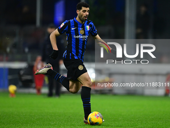 Mehdi Taremi of Inter Milan is in action during the Coppa Italia Frecciarossa match between Inter Milan and Udinese Calcio at Giuseppe Meazz...