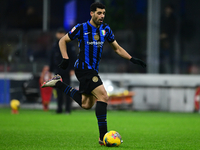 Mehdi Taremi of Inter Milan is in action during the Coppa Italia Frecciarossa match between Inter Milan and Udinese Calcio at Giuseppe Meazz...