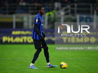 Yann Aurel Bisseck of Inter Milan is in action during the Coppa Italia Frecciarossa match between Inter Milan and Udinese Calcio at Giuseppe...