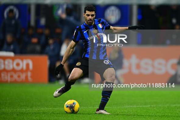 Mehdi Taremi of Inter Milan is in action during the Coppa Italia Frecciarossa match between Inter Milan and Udinese Calcio at Giuseppe Meazz...