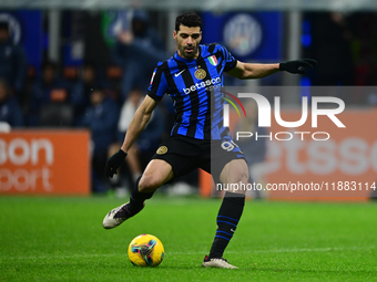 Mehdi Taremi of Inter Milan is in action during the Coppa Italia Frecciarossa match between Inter Milan and Udinese Calcio at Giuseppe Meazz...