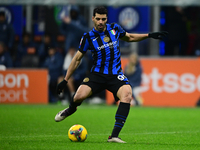 Mehdi Taremi of Inter Milan is in action during the Coppa Italia Frecciarossa match between Inter Milan and Udinese Calcio at Giuseppe Meazz...