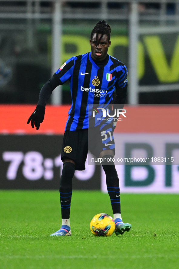 Yann Aurel Bisseck of Inter Milan is in action during the Coppa Italia Frecciarossa match between Inter Milan and Udinese Calcio at Giuseppe...