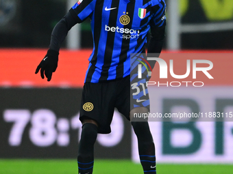 Yann Aurel Bisseck of Inter Milan is in action during the Coppa Italia Frecciarossa match between Inter Milan and Udinese Calcio at Giuseppe...