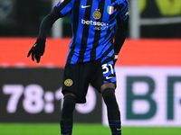 Yann Aurel Bisseck of Inter Milan is in action during the Coppa Italia Frecciarossa match between Inter Milan and Udinese Calcio at Giuseppe...