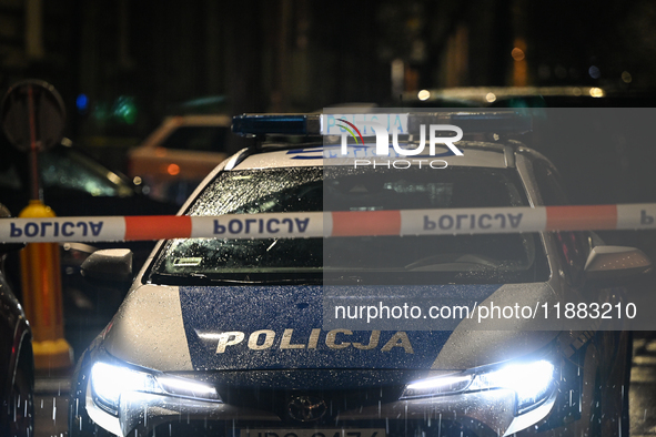 KRAKOW, POLAND - DECEMBER 19:   
Police tape and a police vehicle block Boguslawskiego Street in Krakow’s city center during a security aler...