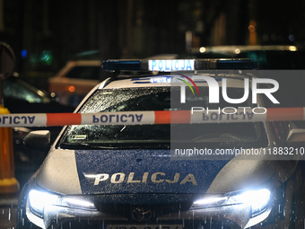 KRAKOW, POLAND - DECEMBER 19:   
Police tape and a police vehicle block Boguslawskiego Street in Krakow’s city center during a security aler...