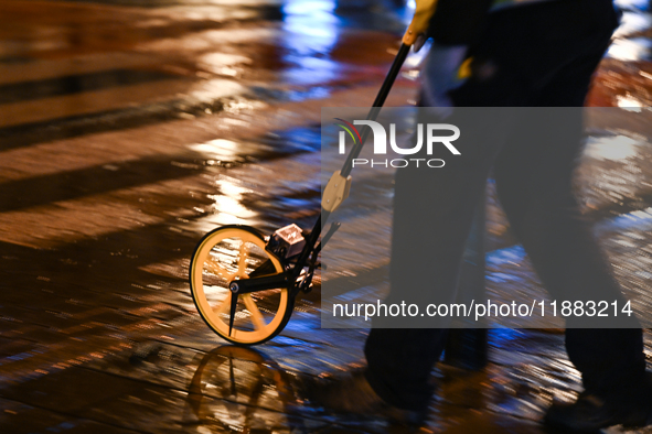 KRAKOW, POLAND - DECEMBER 19:   
A member of the forensic police at the scene of a shooting on Dietla Street, a key route dividing Krakow's...