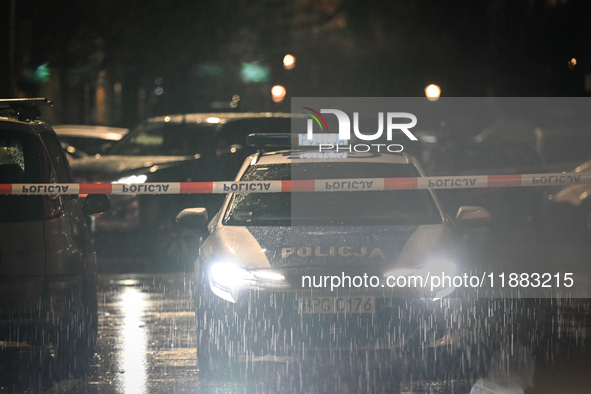 KRAKOW, POLAND - DECEMBER 19:   
Police tape and a police vehicle block Boguslawskiego Street in Krakow’s city center during a security aler...