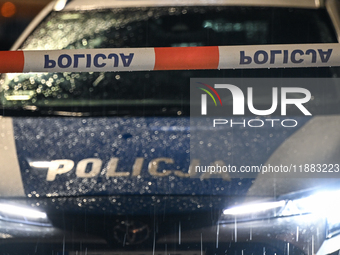 KRAKOW, POLAND - DECEMBER 19:   
Police tape and a police vehicle block Boguslawskiego Street in Krakow’s city center during a security aler...