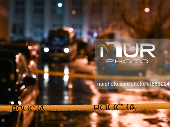 KRAKOW, POLAND - DECEMBER 19:   
Police tape and van at the scene of a shooting on Dietla Street, a key route dividing Krakow's Old Town and...