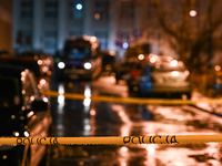 KRAKOW, POLAND - DECEMBER 19:   
Police tape and van at the scene of a shooting on Dietla Street, a key route dividing Krakow's Old Town and...