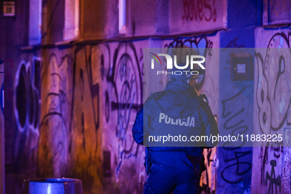 KRAKOW, POLAND - DECEMBER 19:   
Police officer seen standing at Boguslawskiego Street in Krakow’s city center during a security alert at th...