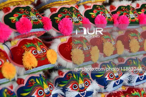 The photo shows tiger-head shoes in Lizhuang village, Zhangxibao town, Yongnian district, Handan city, North China's Hebei province, on Dece...