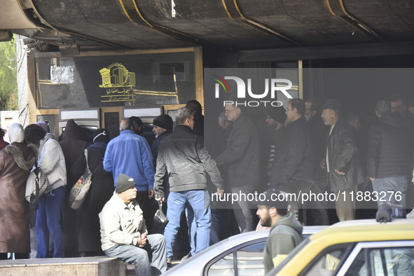 Crowds gather in front of all banks in Syria after a 9-day closure since the fall of the regime on December 19, 2024. 