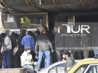 Crowds gather in front of all banks in Syria after a 9-day closure since the fall of the regime on December 19, 2024. (