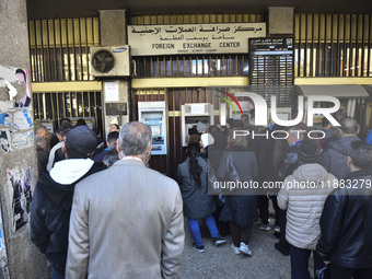 Crowds gather in front of all banks in Syria after a 9-day closure since the fall of the regime on December 19, 2024. (