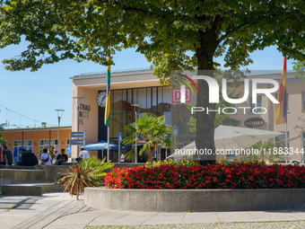 People stand in front of Traunstein Train Station in Traunstein, Bavaria, Germany, on September 16, 2023 (