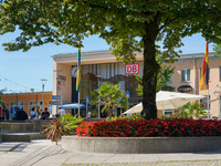 People stand in front of Traunstein Train Station in Traunstein, Bavaria, Germany, on September 16, 2023 (