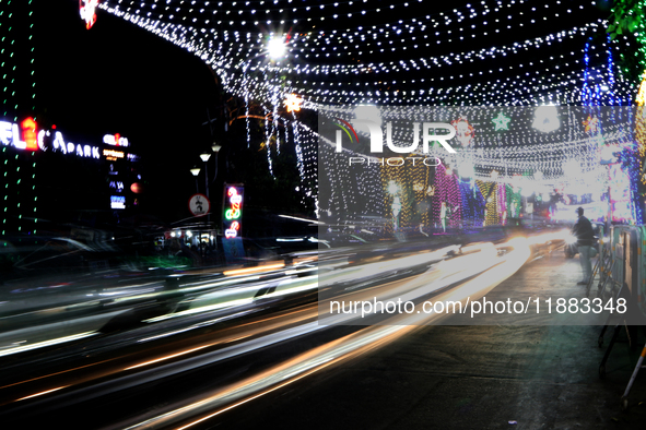 The lighting decoration on Park Street for the upcoming Christmas celebration takes place in Kolkata, India, on December 19, 2024. 