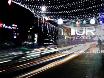 The lighting decoration on Park Street for the upcoming Christmas celebration takes place in Kolkata, India, on December 19, 2024. (