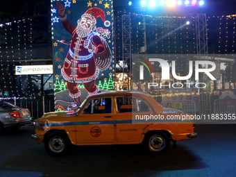 The lighting decoration on Park Street for the upcoming Christmas celebration takes place in Kolkata, India, on December 19, 2024. (