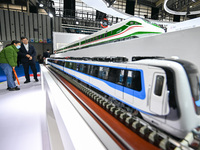 Visitors view a train model at the World Intelligent Manufacturing Expo 2024 in Nanjing, Jiangsu province, China, on December 20, 2024. (