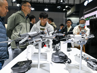 Visitors view DJI drones at the World Intelligent Manufacturing Expo 2024 in Nanjing, China, on December 20, 2024. (