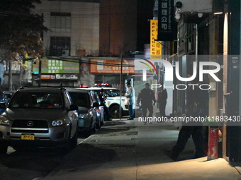 One man is in critical condition and another man is wounded in a shooting in the Flushing section of Queens, New York, United States, on Dec...