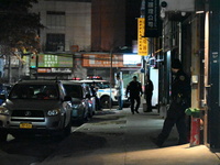 One man is in critical condition and another man is wounded in a shooting in the Flushing section of Queens, New York, United States, on Dec...