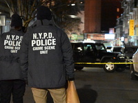 One man is in critical condition and another man is wounded in a shooting in the Flushing section of Queens, New York, United States, on Dec...