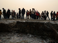 Tourists take a shikara ride on a cold winter morning at Dal Lake in Srinagar, Jammu and Kashmir, India, on December 20, 2024. Srinagar expe...