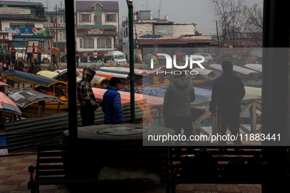 Tourists take a shikara ride on a cold winter morning at Dal Lake in Srinagar, Jammu and Kashmir, India, on December 20, 2024. Srinagar expe...