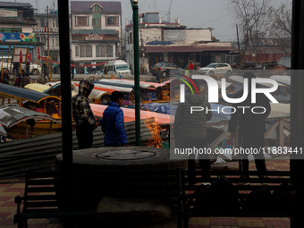 Tourists take a shikara ride on a cold winter morning at Dal Lake in Srinagar, Jammu and Kashmir, India, on December 20, 2024. Srinagar expe...