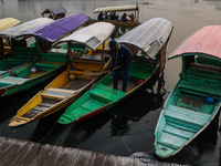 Tourists take a shikara ride on a cold winter morning at Dal Lake in Srinagar, Jammu and Kashmir, India, on December 20, 2024. Srinagar expe...