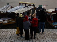 Tourists take a shikara ride on a cold winter morning at Dal Lake in Srinagar, Jammu and Kashmir, India, on December 20, 2024. Srinagar expe...