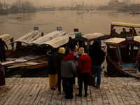 Tourists take a shikara ride on a cold winter morning at Dal Lake in Srinagar, Jammu and Kashmir, India, on December 20, 2024. Srinagar expe...