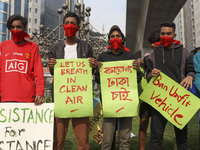 Bangladesh Gach Raksha Andolan, an organization that works on environmental issues, holds a red alert program to demand the control of air p...