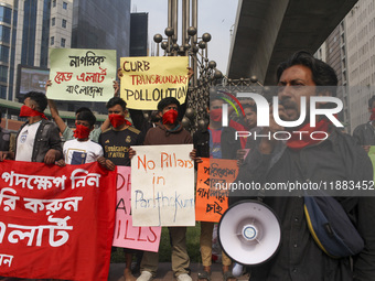 Bangladesh Gach Raksha Andolan, an organization that works on environmental issues, holds a red alert program to demand the control of air p...