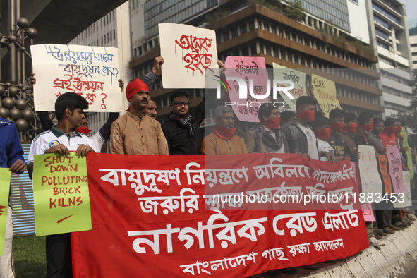 Bangladesh Gach Raksha Andolan, an organization that works on environmental issues, holds a red alert program to demand the control of air p...