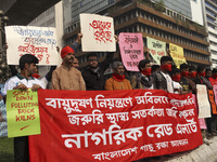 Bangladesh Gach Raksha Andolan, an organization that works on environmental issues, holds a red alert program to demand the control of air p...