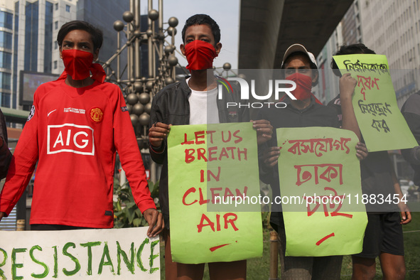 Bangladesh Gach Raksha Andolan, an organization that works on environmental issues, holds a red alert program to demand the control of air p...