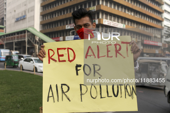 Bangladesh Gach Raksha Andolan, an organization that works on environmental issues, holds a red alert program to demand the control of air p...