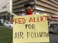 Bangladesh Gach Raksha Andolan, an organization that works on environmental issues, holds a red alert program to demand the control of air p...