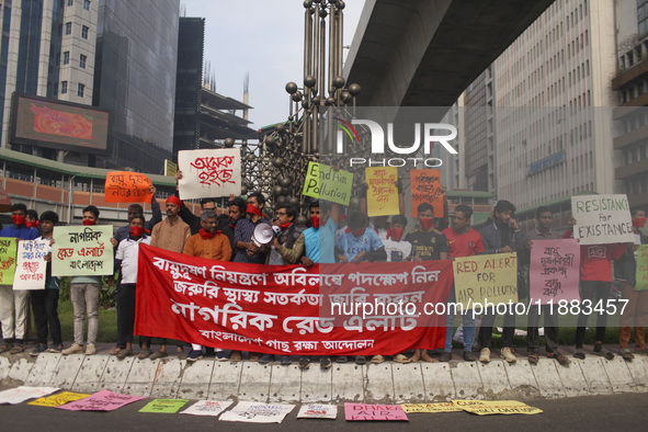 Bangladesh Gach Raksha Andolan, an organization that works on environmental issues, holds a red alert program to demand the control of air p...