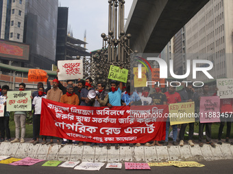 Bangladesh Gach Raksha Andolan, an organization that works on environmental issues, holds a red alert program to demand the control of air p...