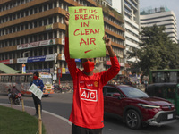 Bangladesh Gach Raksha Andolan, an organization that works on environmental issues, holds a red alert program to demand the control of air p...