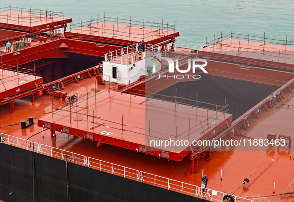 A large ship is about to be delivered at China State Shipbuilding Corporation Qingdao Beihai Shipbuilding Co LTD in Qingdao, China, on Decem...