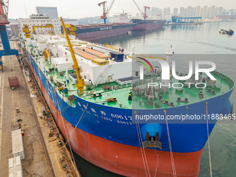 A large ship is about to be delivered at China State Shipbuilding Corporation Qingdao Beihai Shipbuilding Co LTD in Qingdao, China, on Decem...